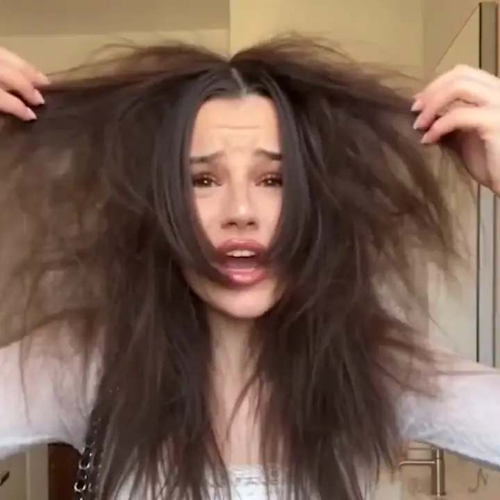 A woman showing tangled hair, then brushing it smooth, then the product she used